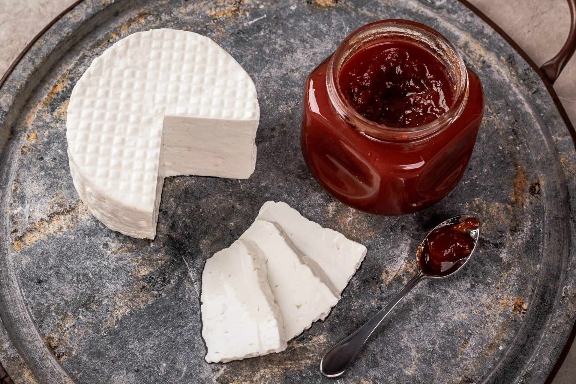 Brazilian dessert Romeo and Juliet, goiabada jam of guava and cheese Minas on gray board. Selective focus