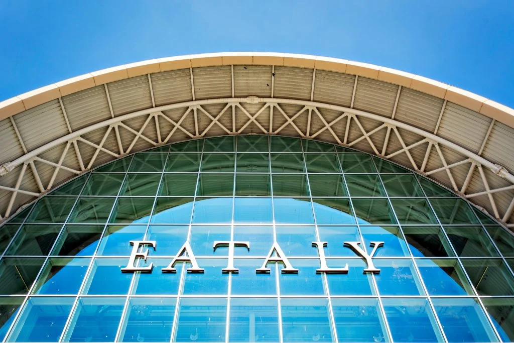Rome, Italy, April 2017: bottom view of the exterior glass facade of the famous Italian food store Eataly in Rome
