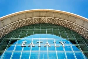 Rome, Italy, April 2017: bottom view of the exterior glass facade of the famous Italian food store Eataly in Rome