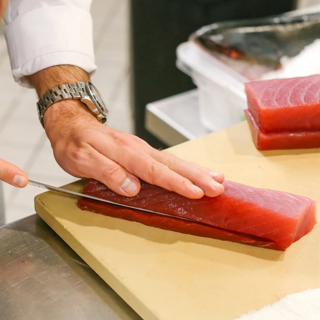 Chef slicing fresh tuna