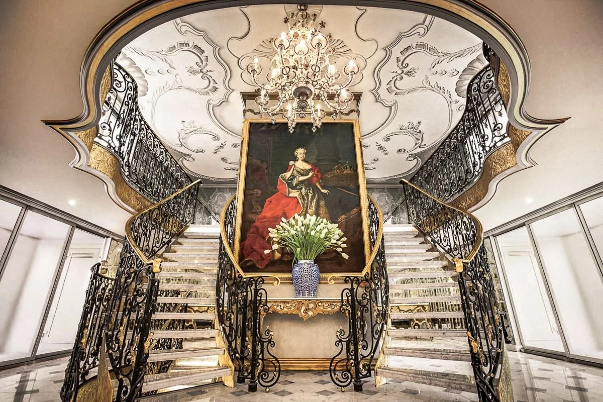 Double staircase and portrait of Maria Theresa on the Uniworld S.S. Maria Theresa river cruise ship
