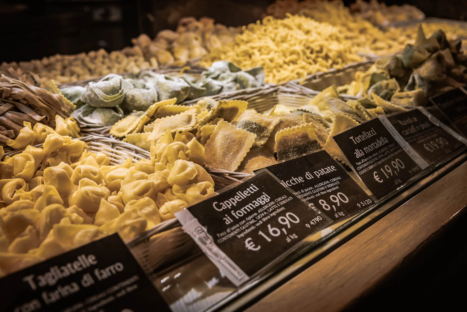 BOLOGNA, ITALY - FEBRUARY 08, 2017. Food court selling fresh pasta by weight.